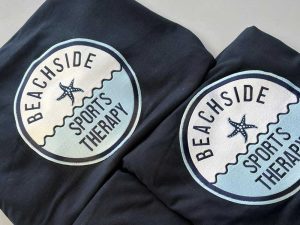 Embroidered uniforms for beachside sports therapy